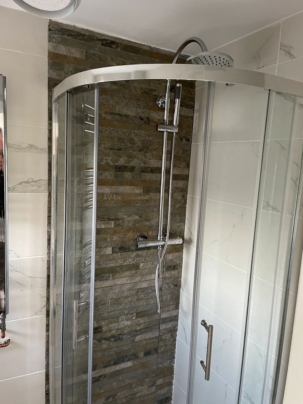 Curved shower enclosure