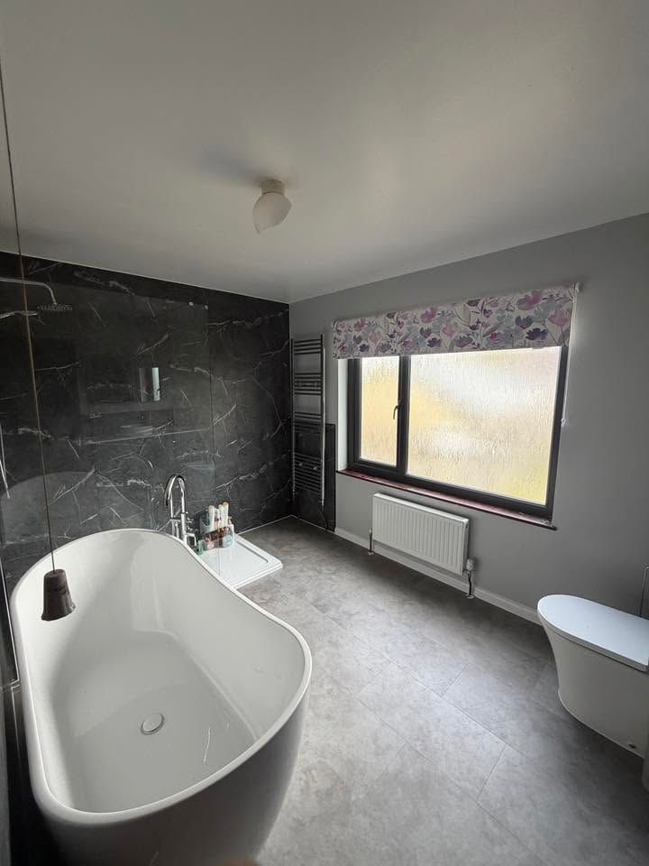 Bathroom with grey wall tiles